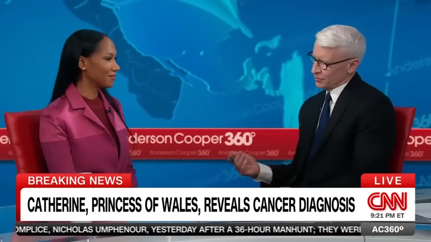 A news anchor in glasses interviews a woman in a pink blazer on cnn's anderson cooper 360 with a breaking news banner about catherine princess of wales' cancer diagnosis.